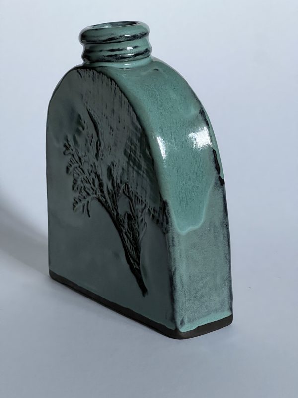 Vase, turquoise on black clay, decor