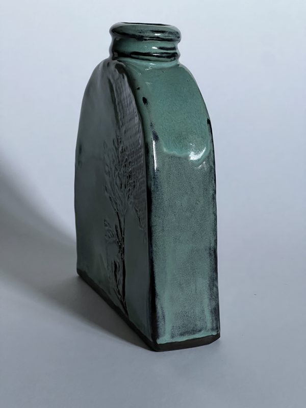 Vase, turquoise on black clay, decor